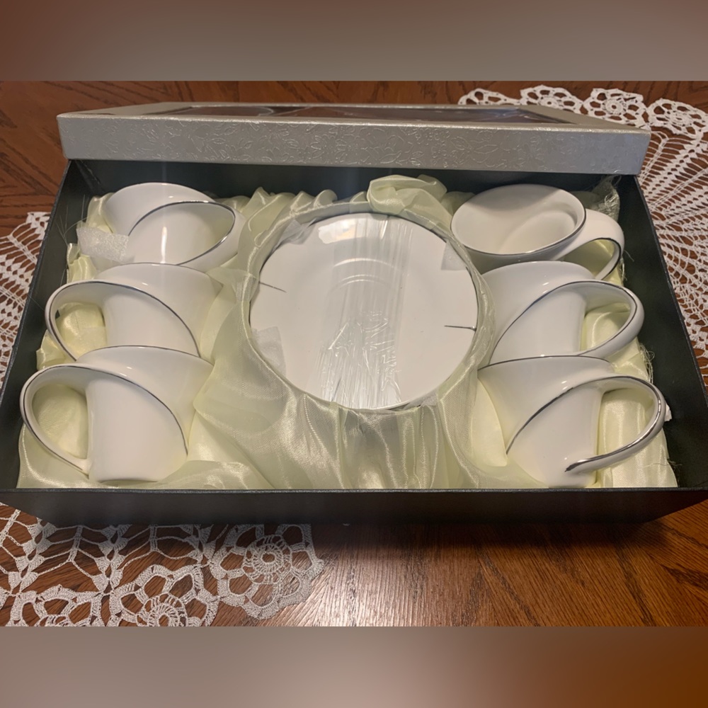 porcelain coffee cup set with little plates